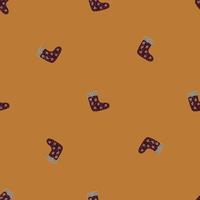 Seamless pattern in minimalistic style with doodle brown socks ornament. Beige background. Simple design. vector