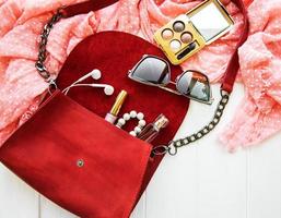 Red leather bag with accessories photo