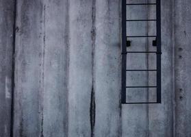 concrete wall with ladder photo