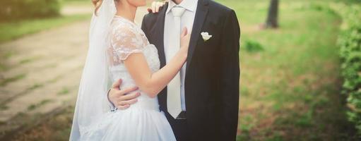 bride and groom hugging photo