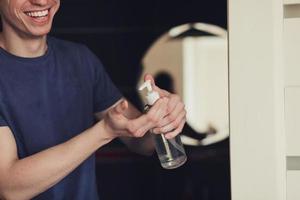 healthy happy man with liquid antibacterial soap photo