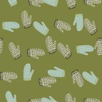 Knitted wool mittens seamless pattern in doodle style. Cozy christmas clothes with green background. vector