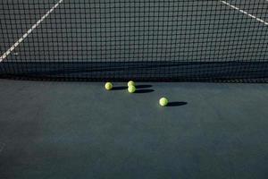 tennis balls on court photo