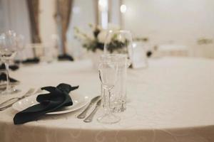 table setting for wedding celebration in restaurant. photo