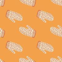 White mittens with red ornament seamless doodle pattern. Orange bright background. Season winter print. vector