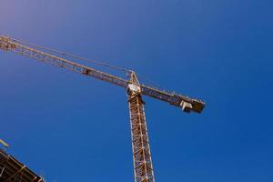 Construction crane against the sky photo