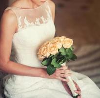 bride with a bouquet of roses photo