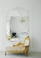 room with royal sofa and mirror photo