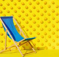 blue chair on a bright yellow background photo