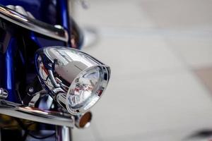 chrome headlight of a motorcycle photo
