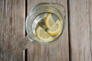 Lemon water on the table photo