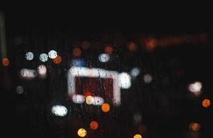 bokeh at night, cityscape in rain photo