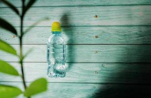 Water bottle on a wooden background. photo