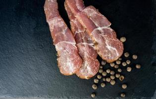 Pork bacon on background photo