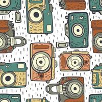 Seamless pattern cameras in doodle on white with dashes background. Vintage texture of fun retro camera for fabric green and orange colors. Modern hipster art in flat style. vector