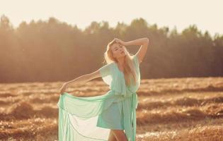 passionate blonde in field photo