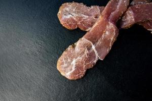 Raw sliced bacon photo