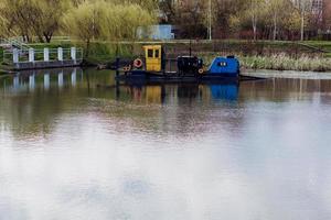 garbage collection boat for cleaning the river photo