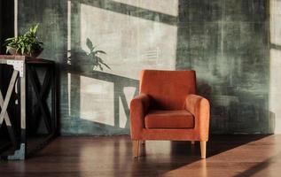 armchair against wall in living room photo