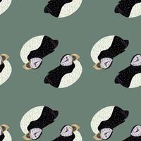 ABstract tropic arctic animal seamless pattern with black and white colored puffin shapes. Pale blue background. vector