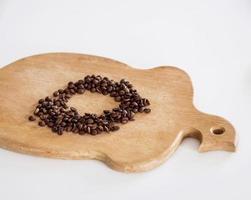 Coffee beans on wooden board photo