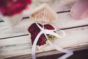 Wedding rings with red flowers photo