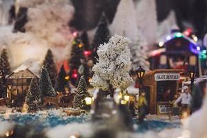 Miniature people relax at Christmas photo