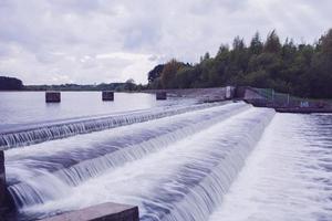 a small dam with water photo