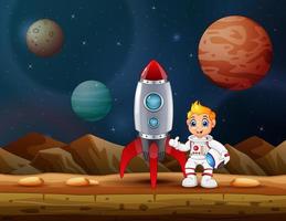 Astronaut boy standing near a rocket spaceship on the moon vector