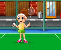 Beautiful girl playing badminton at the court vector