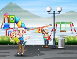 Happy family having fun at snowy playground vector