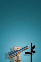 Cover page with old antique metal telescope standing near stack of books with a post showing directions at gradient blue background with copy space and shadow. Concept exploration, education, travel. photo