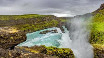 Panoramic view over waterfall wonder Gullfoss in South Iceland, Golden Circle, at summer with dramatic sky. photo