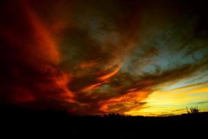 Apocalyptic sunset. Fiery red sunset. photo