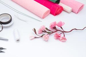 Tools and materials for creating a spring branch with sakura flowers from corrugated paper. Do it yourself photo