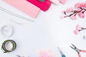 Tools and materials for creating a spring branch with sakura flowers from corrugated paper. Do it yourself photo