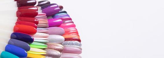 Color palette with nail gel polishes for manicure on a white background. Banner with copy space photo