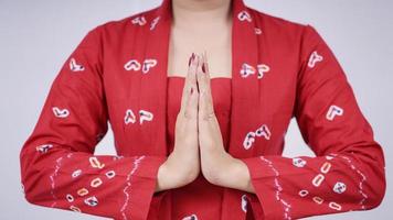 asian beauty in kebaya welcome gesture isolated on white background photo