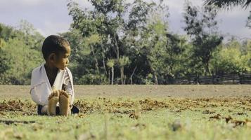 A portrait of Children with a shabby look in a poor and isolated village of Rote Island, East Nusa Tenggara. April 5, 2020 - Rote, Indonesia. photo