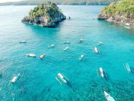 Aerial drone view of ocean, boats, beach, shore, Bali, Indonesia photo