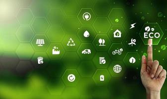 Eco technology or environmental technology concept with environment Icons over the network connection on green leaf energy sources for renewable, sustainable development photo