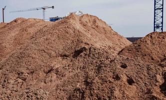 a pile of sand on a construction site photo