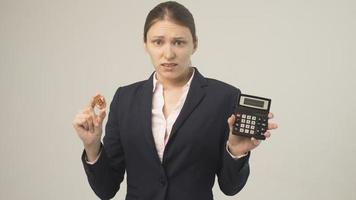 golden bitcoin in the hand of a beautiful business girl photo