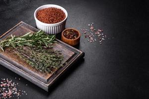 Bundle of fresh thyme grass on a wooden cutting board photo