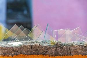 Dangerous wall with broken glass shards Playa del Carmen Mexico. photo