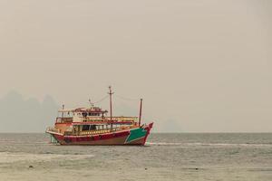 Boat for trip in Thailand. Phan Nga Phan-Nga Bay. photo