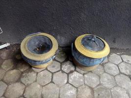 two trash cans made from old rubber tires photo