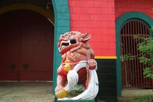 red lion statue in sam poo kong semarang photo