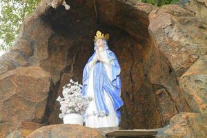 Editorial image of the statue of the Virgin Mary at the prayer place of Maria's Cave, Semarang, Indonesia photo