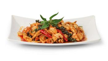 Stir fried holy basil with octopus or squid and herb - Asian food style, Spicy seafood stir fried with Thai herb. photo